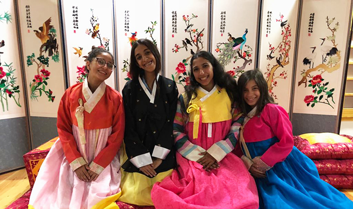 Students from Creative International School try on Hanbok at the Korean Cultural Center in Egypt on Oct. 16.